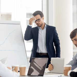 man showing signs of anxiety at workplace setting