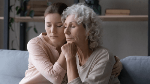 daughter giving support to mother in grief